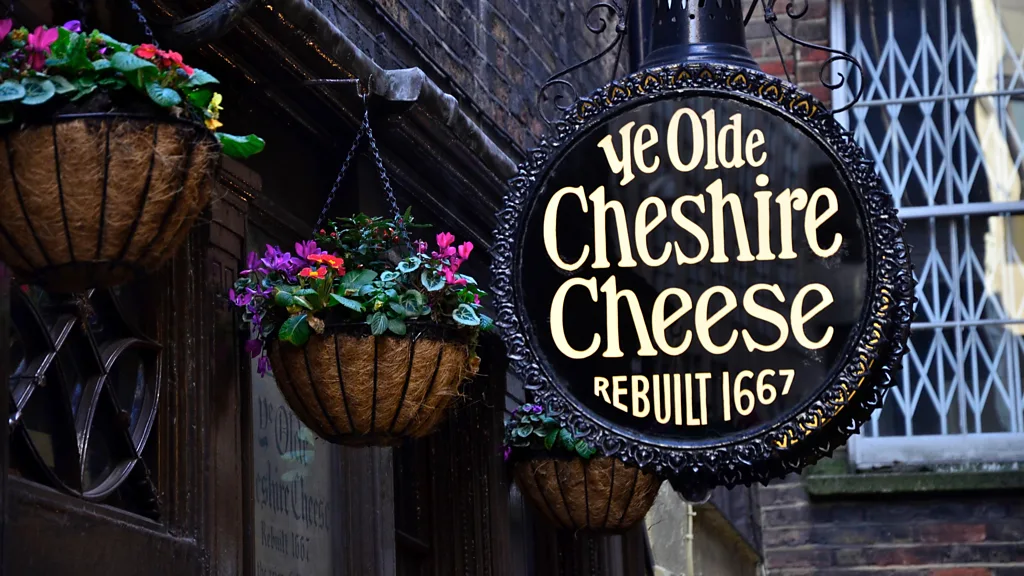 The interior of Ye Olde Cheshire Cheese, a historic pub in London. The image showcases the pub's cozy and traditional atmosphere, with wooden beams, vintage decor, and dim lighting. Patrons are seen enjoying their drinks and meals, creating a lively and welcoming ambiance that reflects the rich history of this iconic establishment.